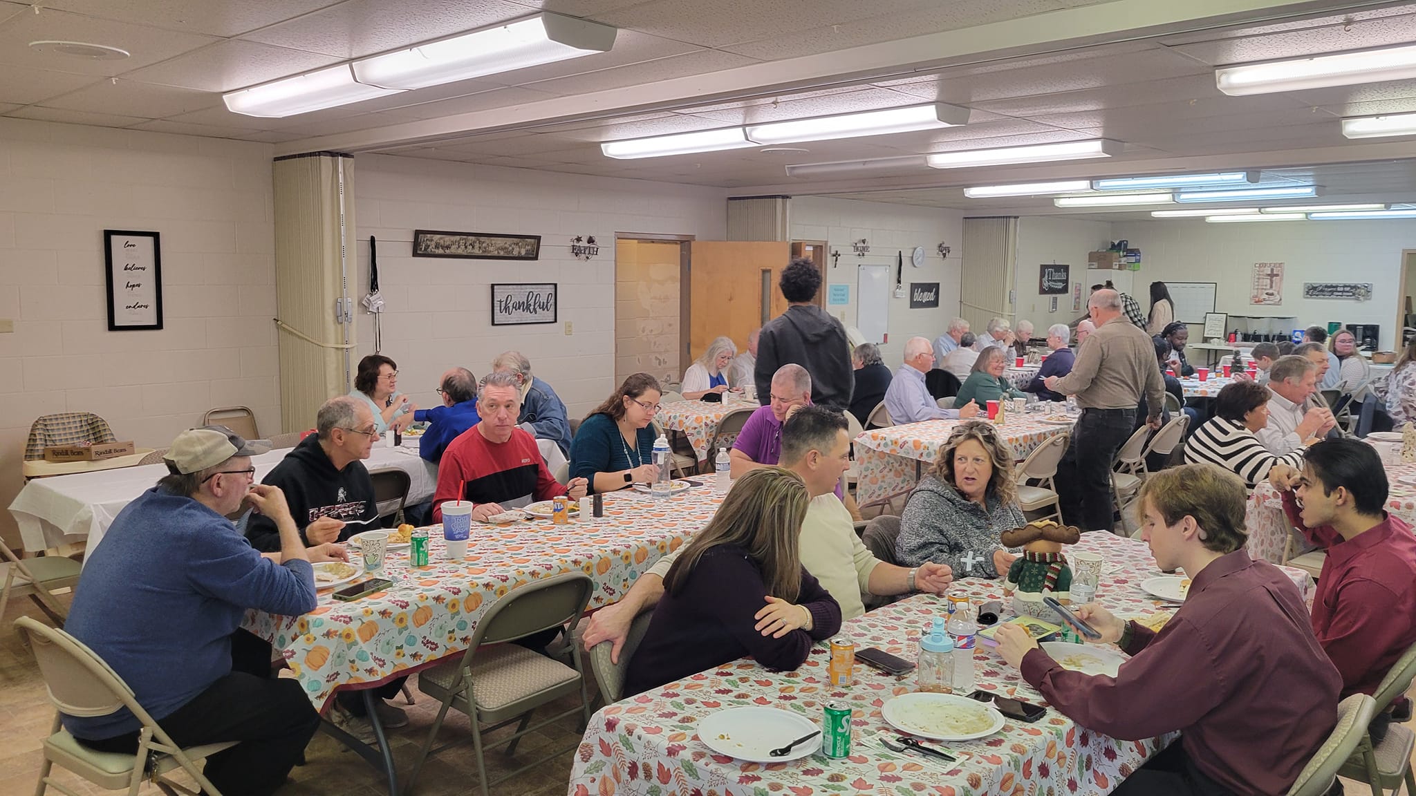 Church fellowship meal with congregation members sharing a meal together