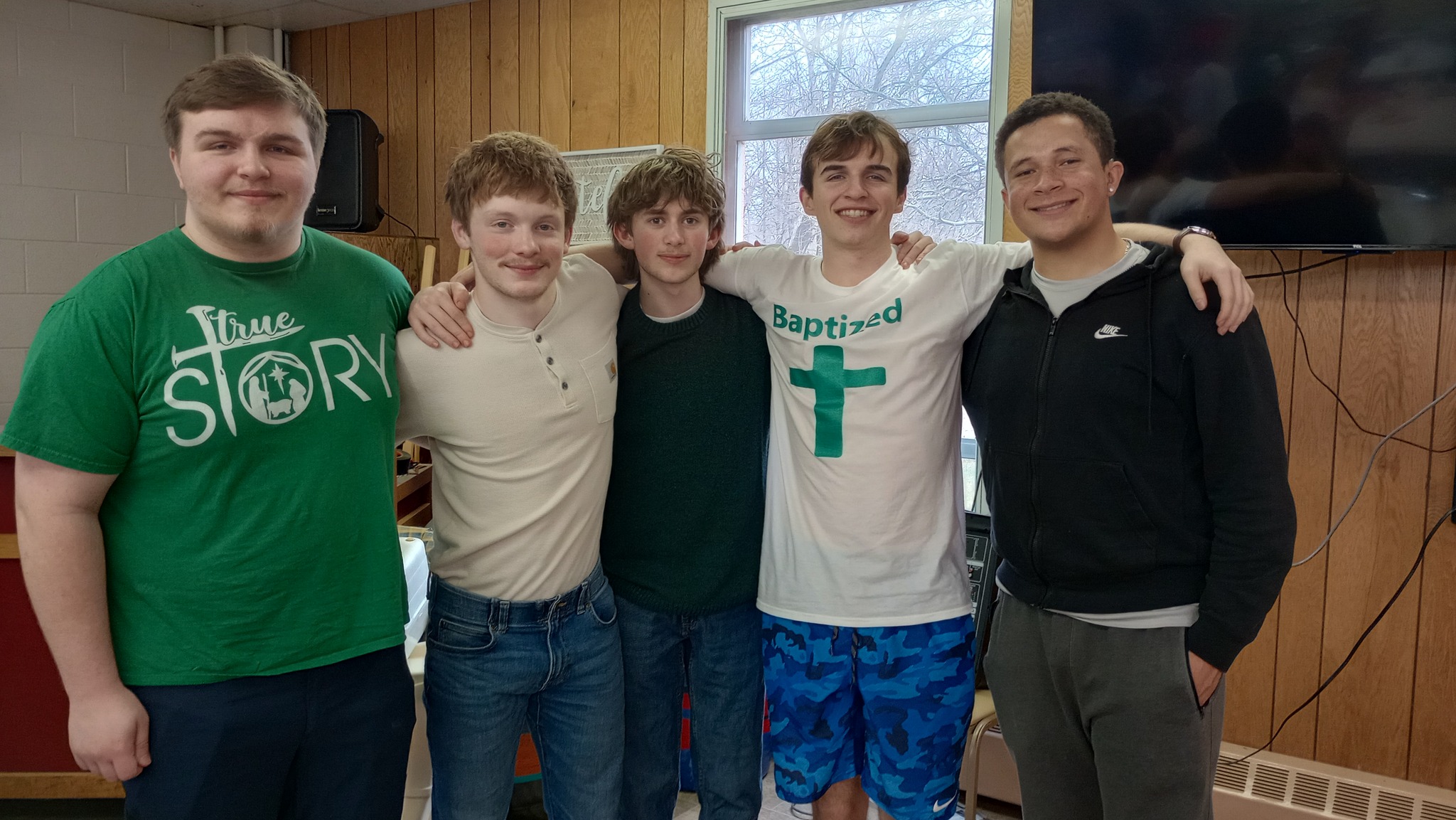 Youth group members standing together after service